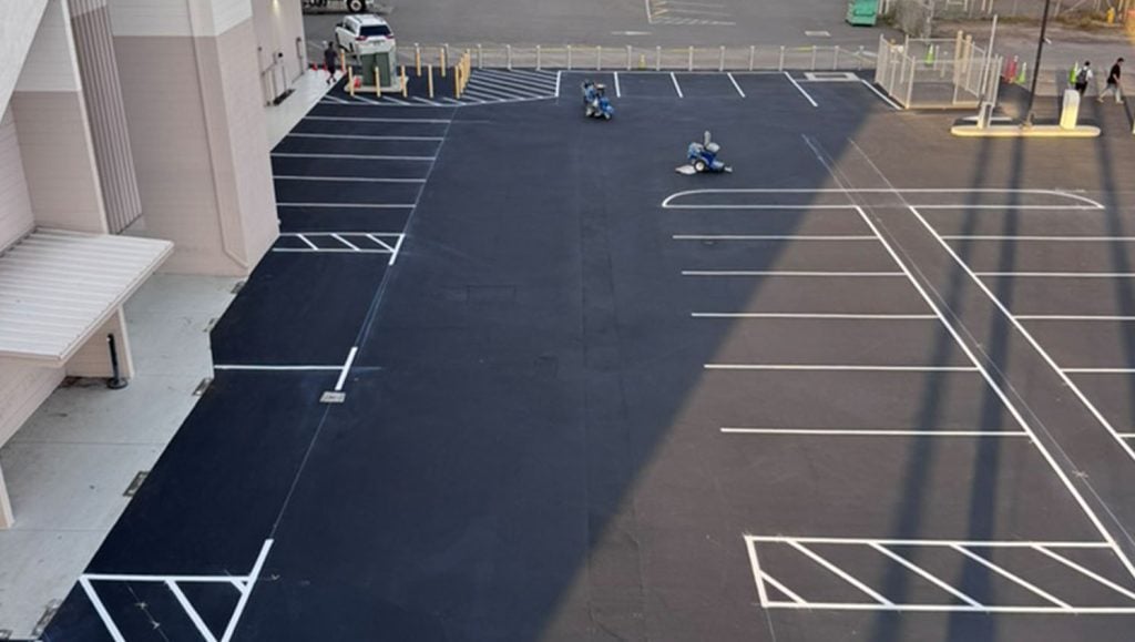 aerial view of freshly painted parking spots for Lānai Air parking lot