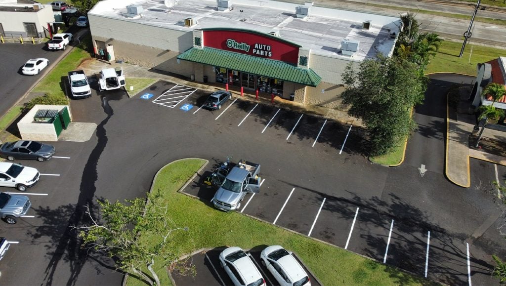 close-up of freshly painted line markings for auto part store parking lot