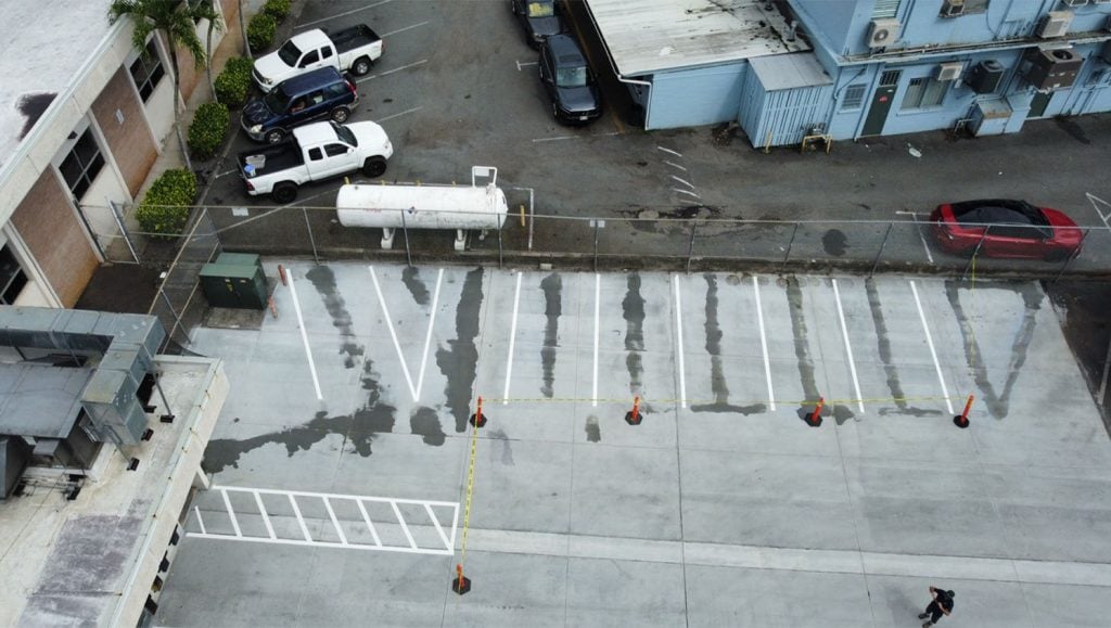 USPS parking lot with freshly painted parking spots aerial view