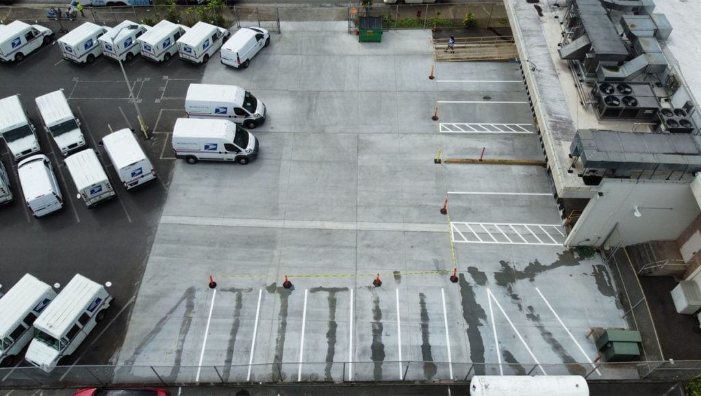 aerial view of USPS parking lot freshly painted