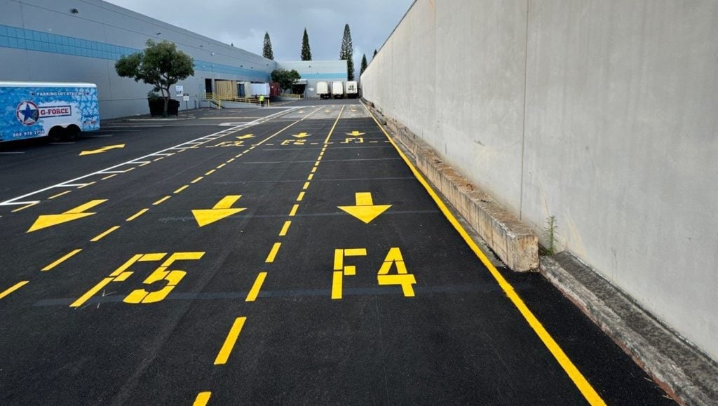 close-up of "F3" in yellow line marking for walmart parking lot