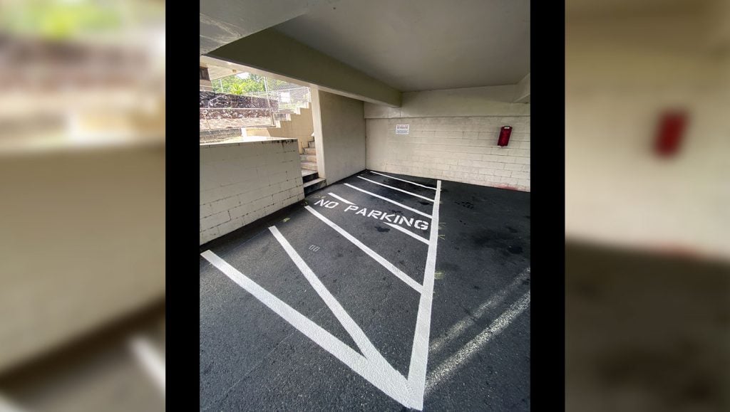 visitor parking stencil painted on kaneohe parking lot