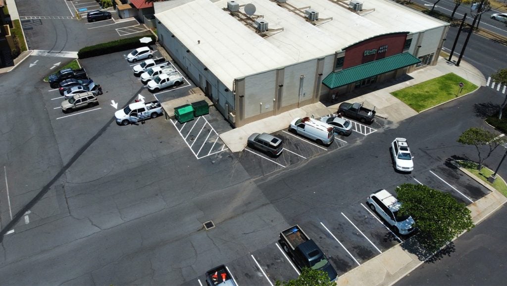 aerial view of O'Reilly Auto Parts parking lot with freshly painted line markings