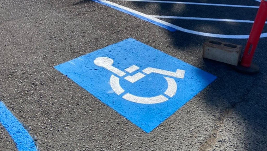 Coral Creek Golf Course parking lot with freshly painted ada compliance parking spot