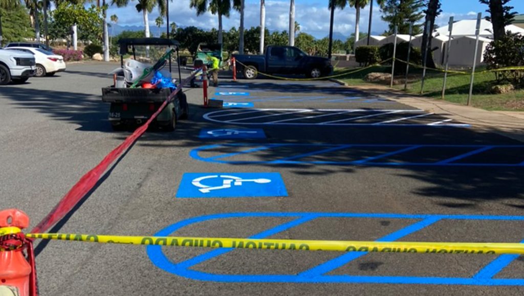 ada compliance parking spots freshly painted for Coral Creek Golf Course parking lot