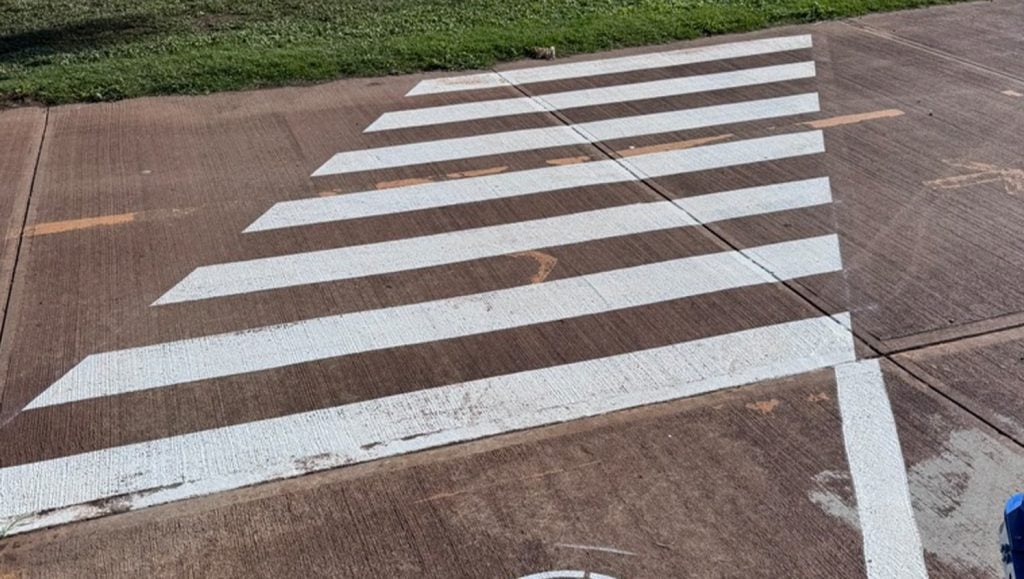 freshly painted crosswalk for Coral Creek Golf Course parking lot
