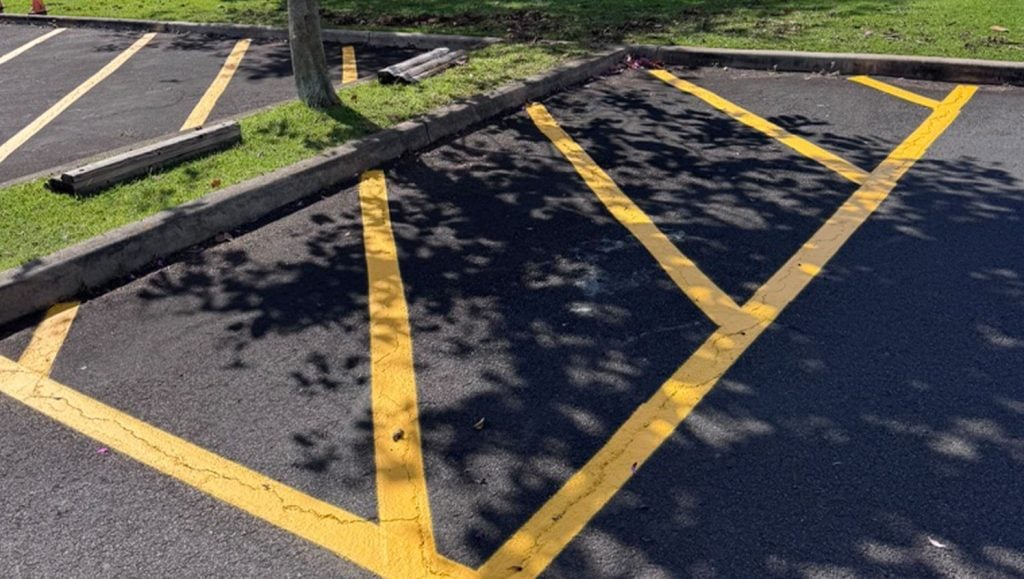 yellow crosswalk freshly painted for Grace Fellowship Church parking lot
