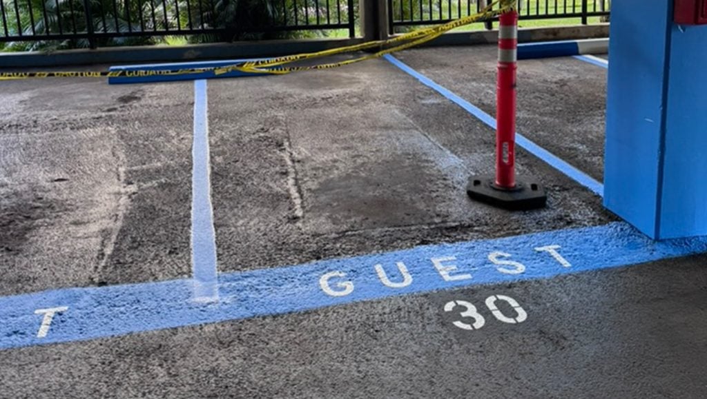 Parkland Gardens Condominium parking lot with freshly painted parking spots