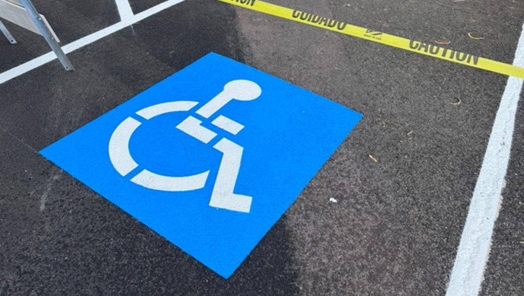 ada compliance parking spot freshly painted for The Core Group Construction parking lot