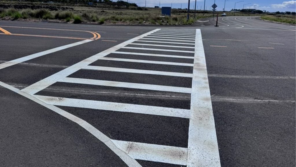PC Construction parking lot with a freshly painted crosswalk