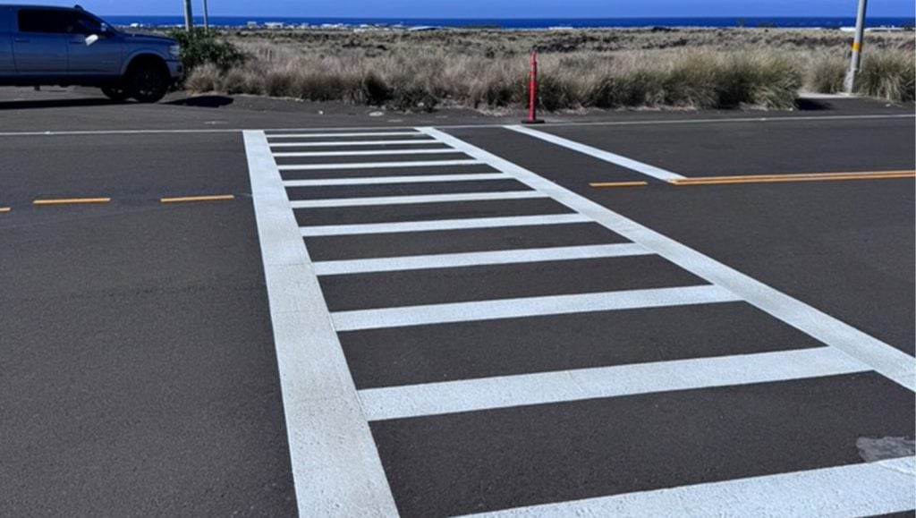 close-up of crosswalk freshly painted for PC Construction parking lot