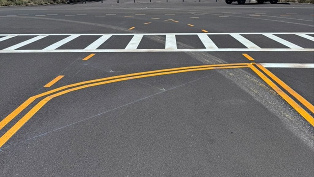 close-up of freshly painted line markings for PC Construction parking lot