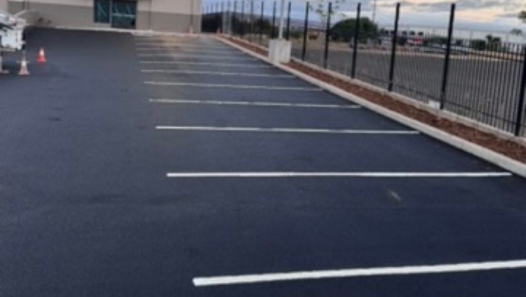Honolulu Cookie Company parking lot with freshly painted line markings