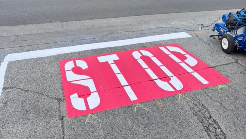 stop freshly painted on Kapa'a Industrial parking lot