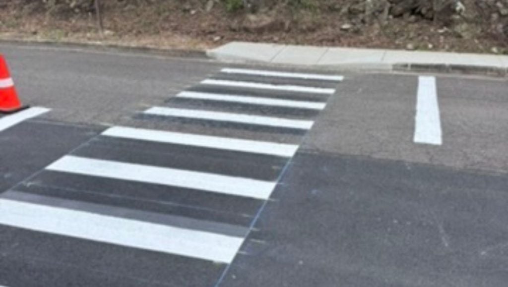 crosswalk freshly painted for TCG Construction parking lot