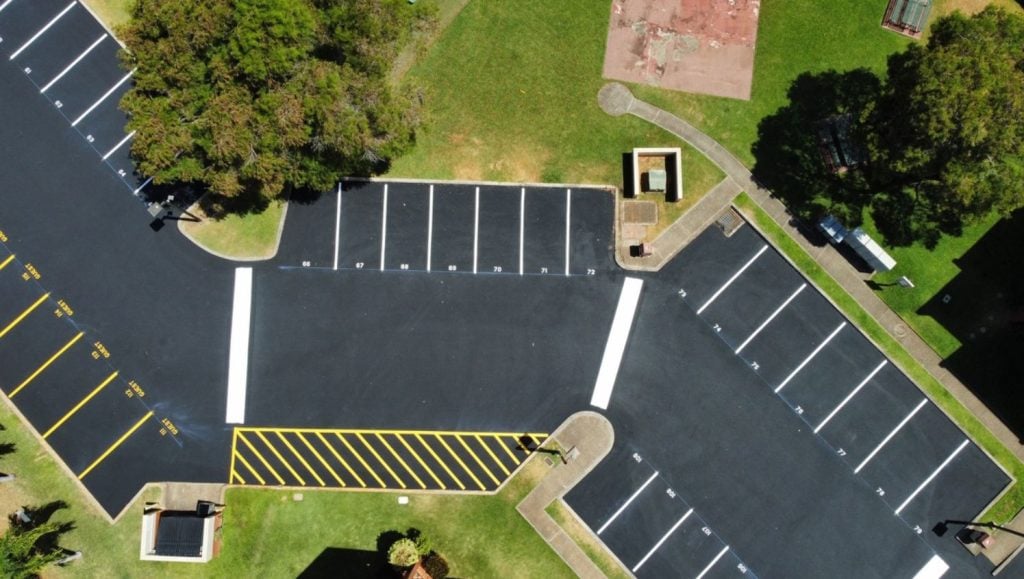 Acacia Apartments parking lot freshly painted aerial view