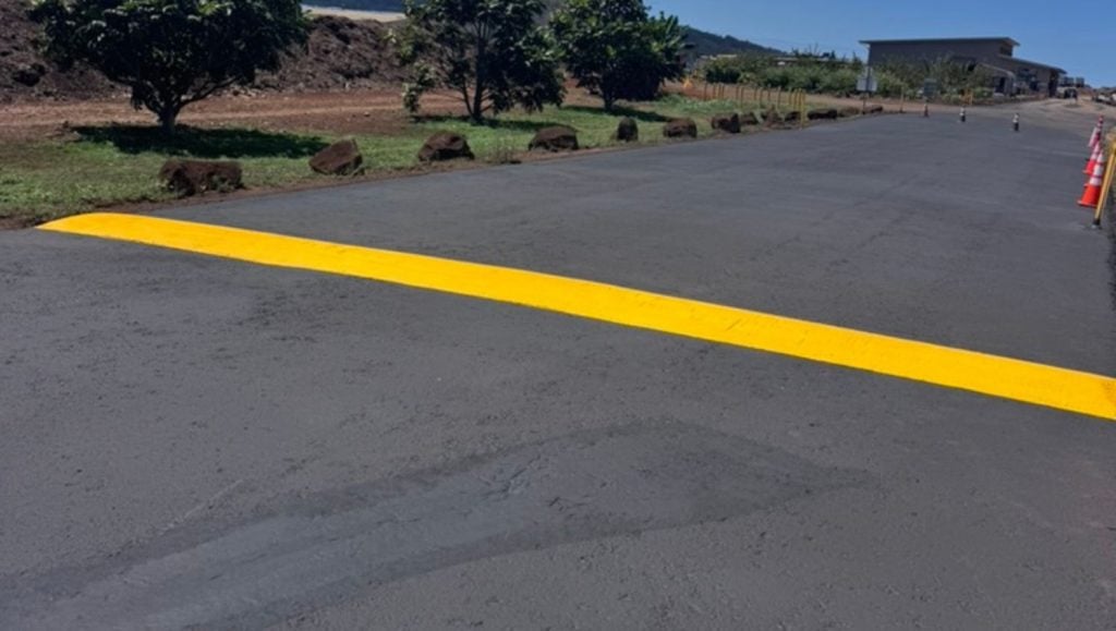 Hawaiian Earth Products parking lot freshly painted close-up