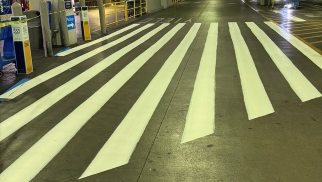close-up of white crosswalk freshly painted for Walmart Honolulu (Super Center) parking lot