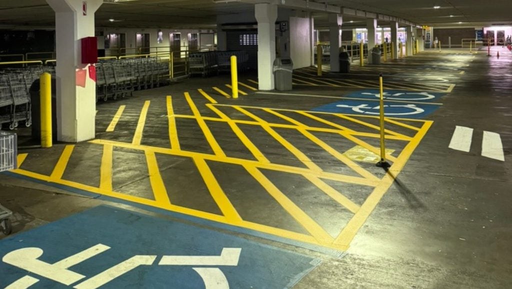 ada compliance parking spots freshly painted for Walmart Honolulu (Super Center) parking lot