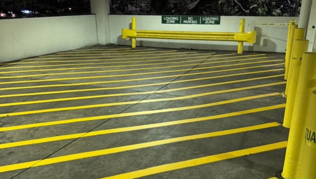 yellow line markings freshly painted for Walmart Honolulu (Super Center) parking lot