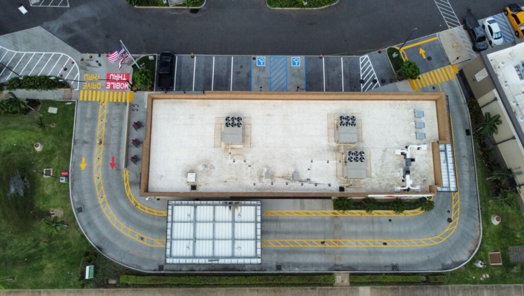 freshly painted line markings for Chick Fil-A Kapolei Parkway parking lot