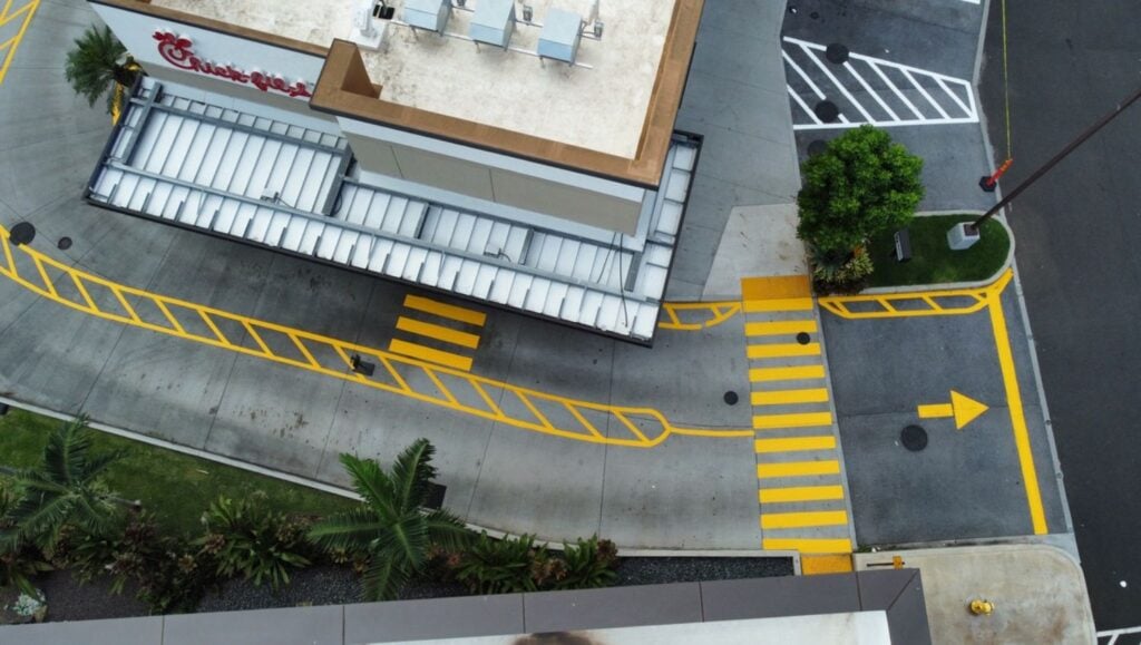 yellow line markings freshly painted for Chick Fil-A Kapolei Parkway