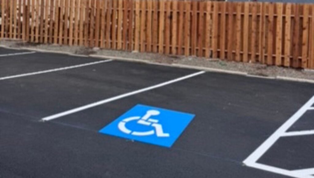 ada compliance parking spot freshly painted for Denny's Waikiki parking lot