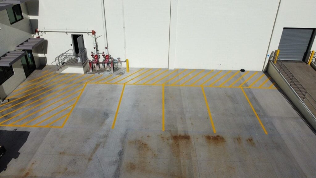yellow parking spots freshly painted for Freight Company
