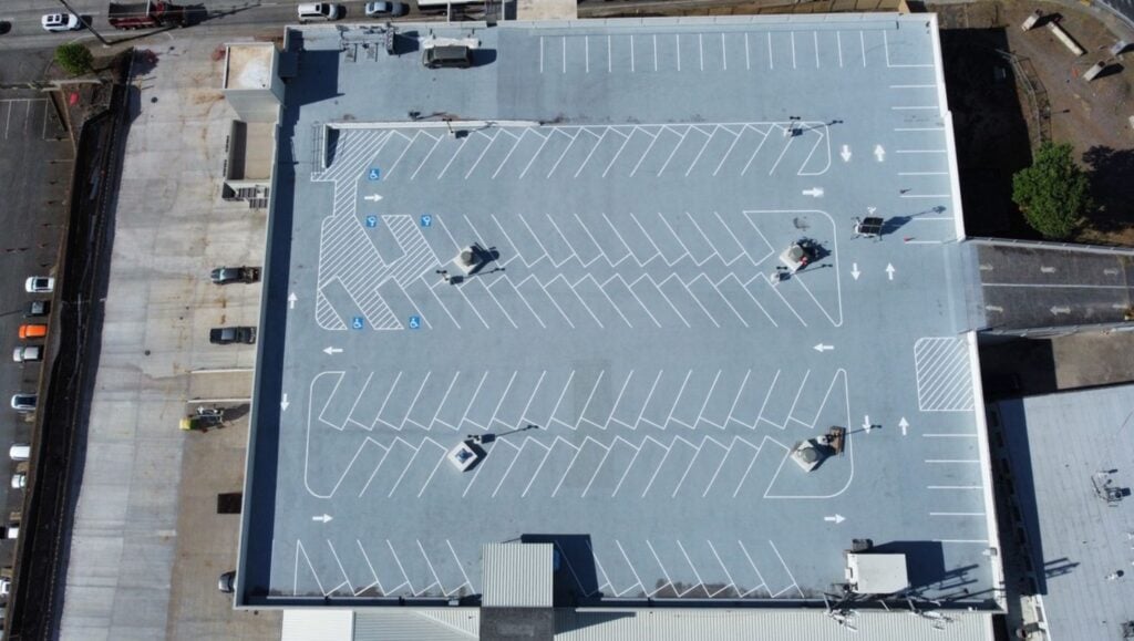parking spots freshly painted for Honolulu Freight Company rooftop