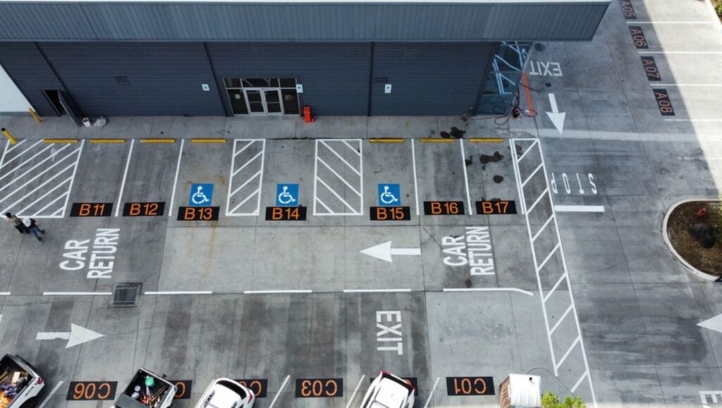 aerial view of SIXT Car Rental parking lot freshly painted