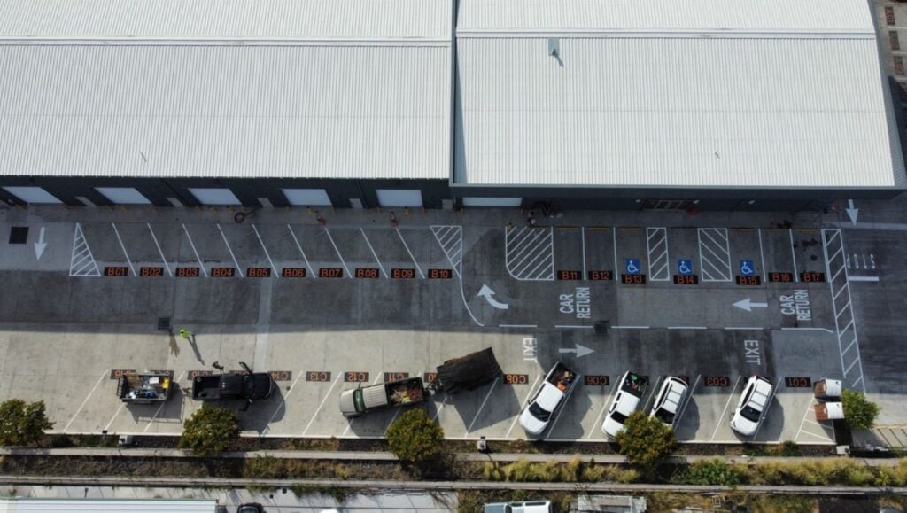 white line markings freshly painted for SIXT Car Rental parking lot