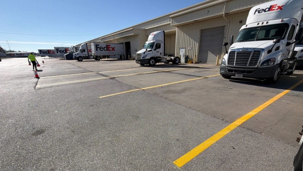 yellow line markings freshly painted for FedEx warehouse
