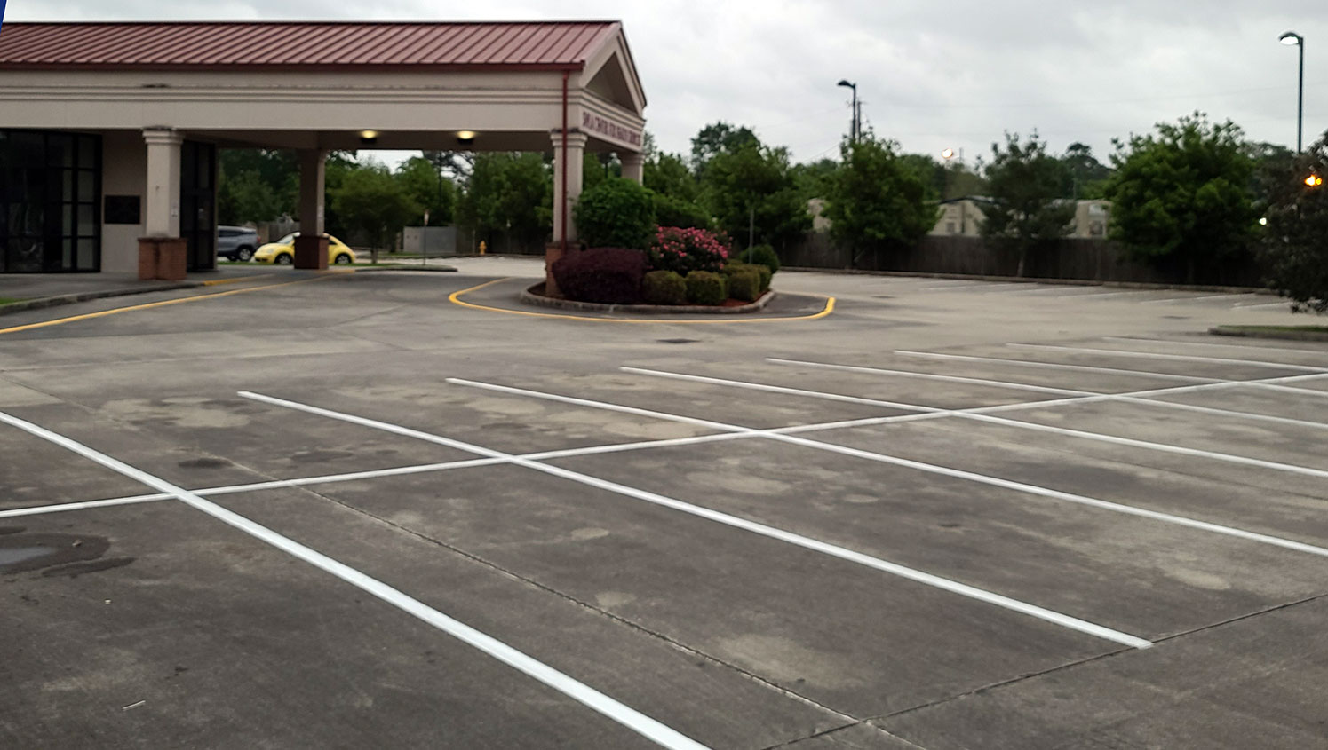 freshly striped parking spaces at a commercial property in Lafayette, LA