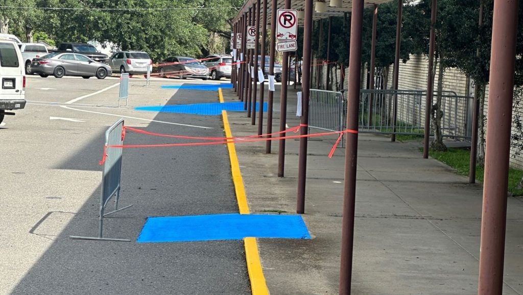 sidewalk freshly painted for Heymann Performing Arts Center parking lot