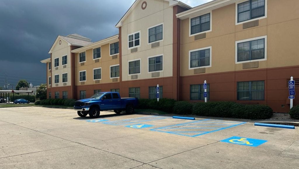 front view of Extended Stay America parking lot freshly painted