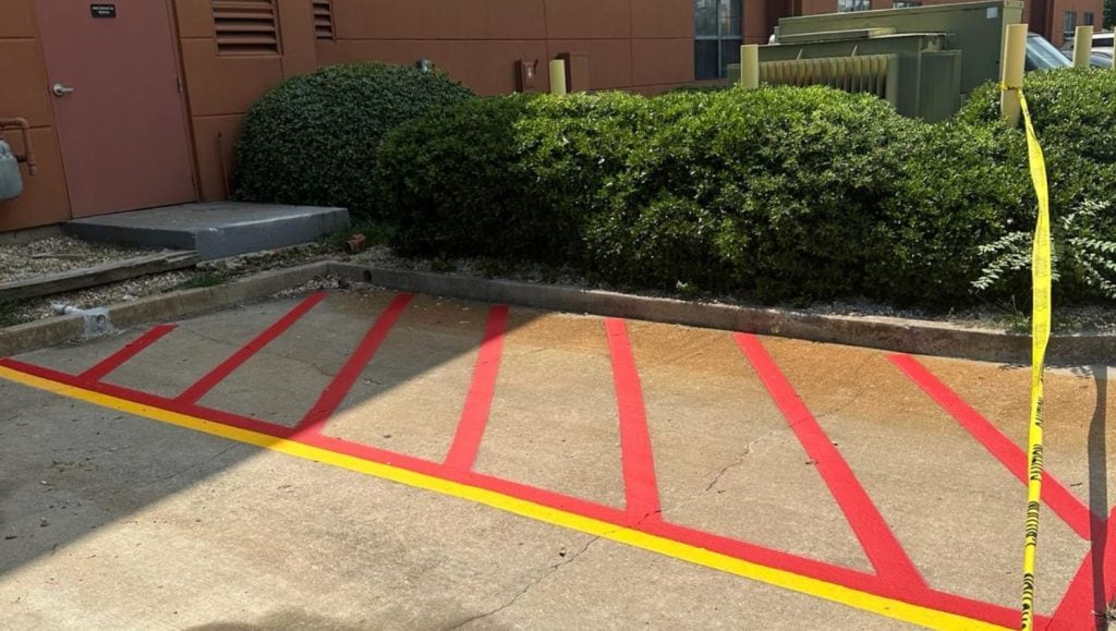 red line markings freshly painted for Extended Stay America