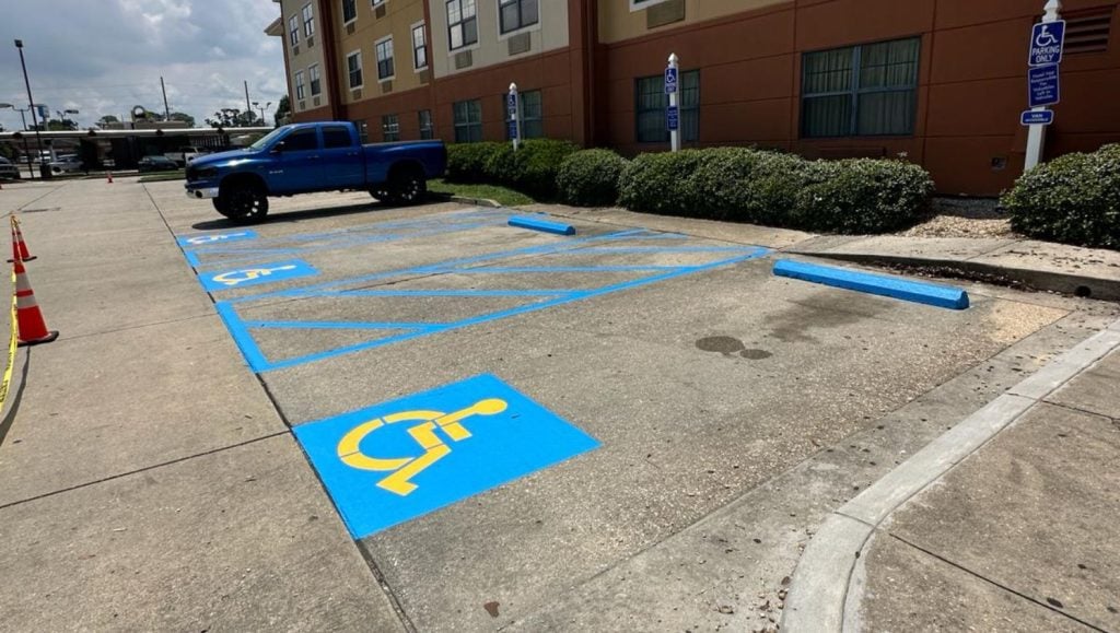 ada compliance parking spots freshly painted for Extended Stay America parking lot