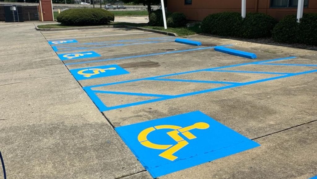 close-up of ada compliance parking spots freshly painted for Extended Stay America