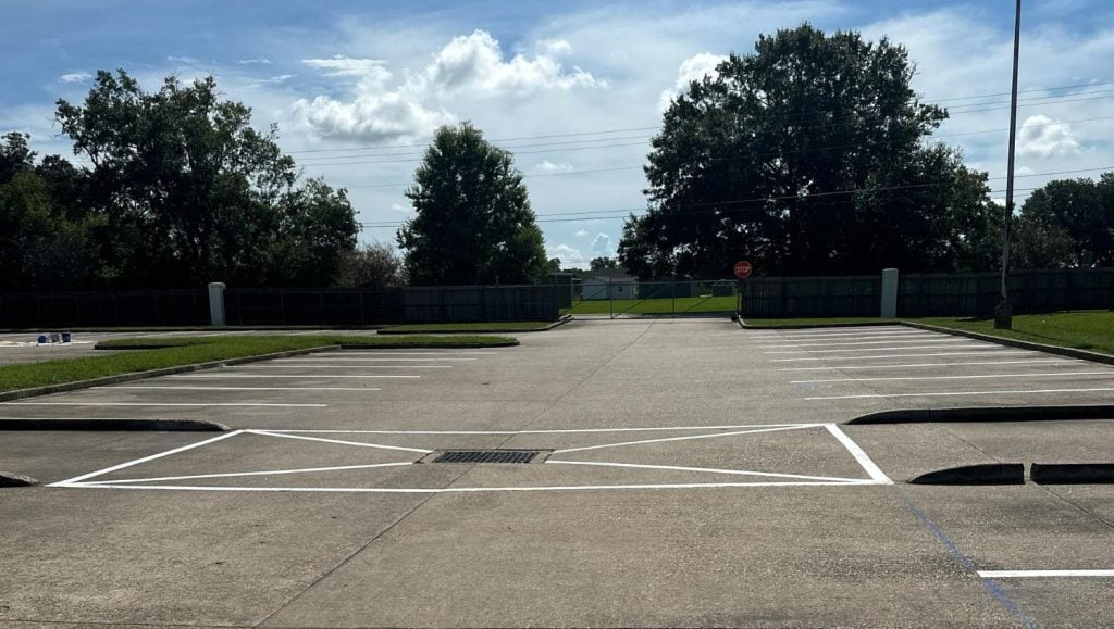 close-up of freshly painted line markings for Les Vieux Chenes Golf Course parking lot