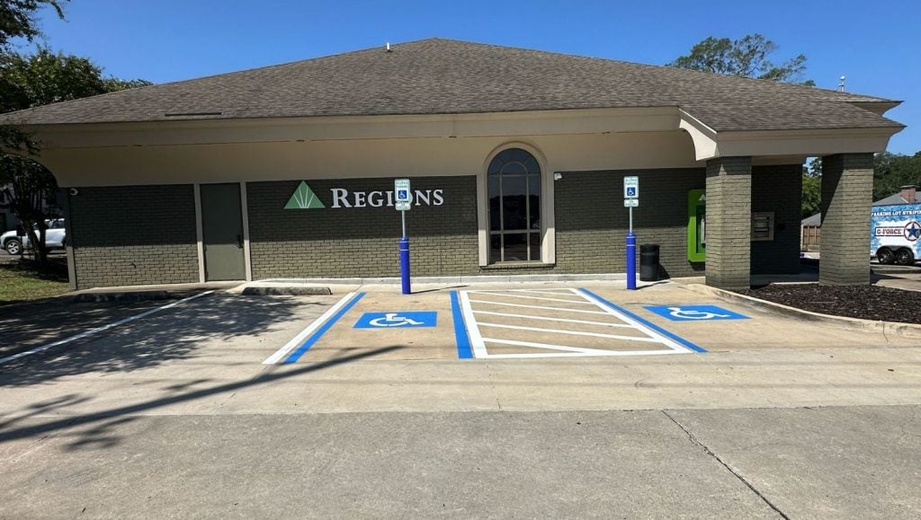 front view of Regions Bank parking lot freshly painted