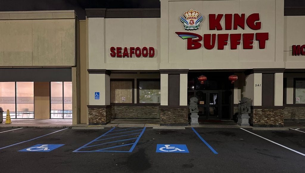 close-up of ada compliance parking spots freshly painted for Rouses’s Market