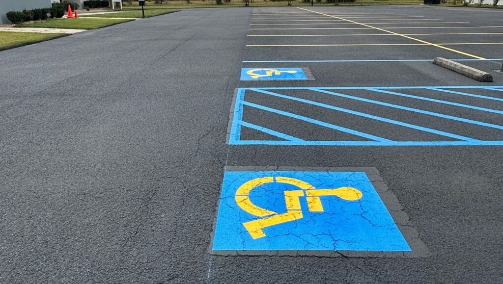 close-up of ada compliance parking spots freshly painted for Vineyard Church parking lot