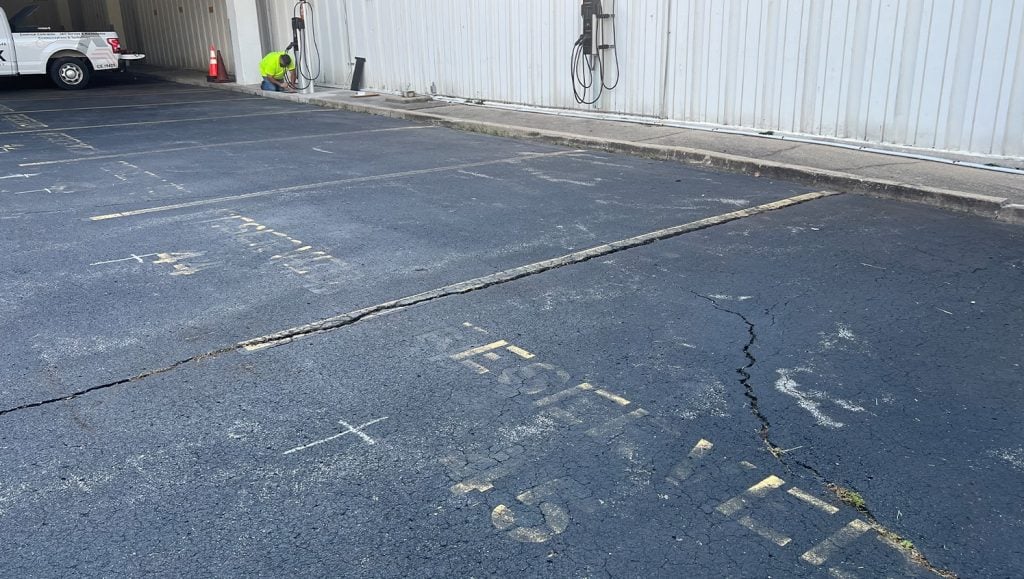 Amteck of KY Inc. parking lot with faded line markings