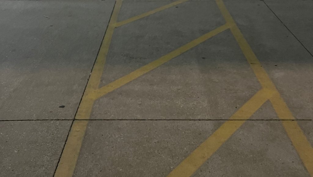 faded cross walking lines at Aldi parking lot