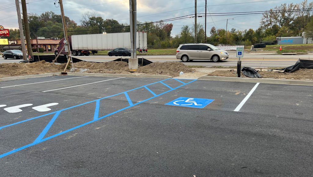 ada compliance parking spots freshly painted for Realm Construction Company