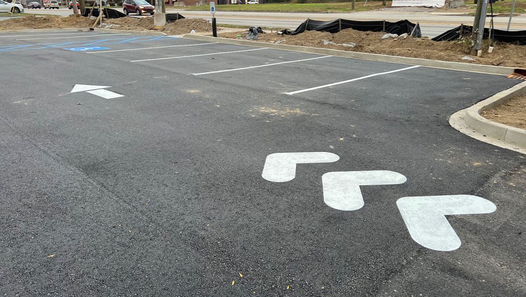 freshly painted line markings for Realm Construction Company parking lot