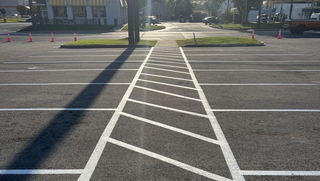 front view of Freedom Plasma parking lot with freshly painted parking spots