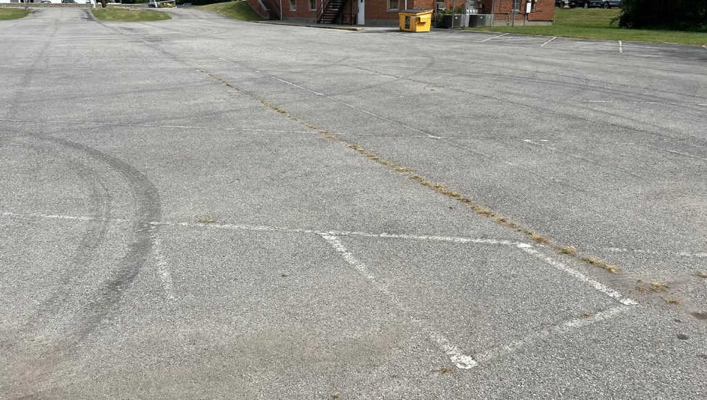 freshly painted arrow for The Greater Faith Church of Deliverance parking lot