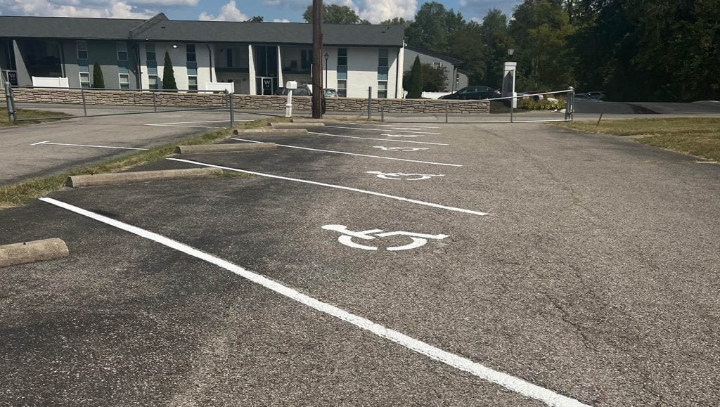 faded crosswalk line markings for The Greater Faith Church of Deliverance parking lot