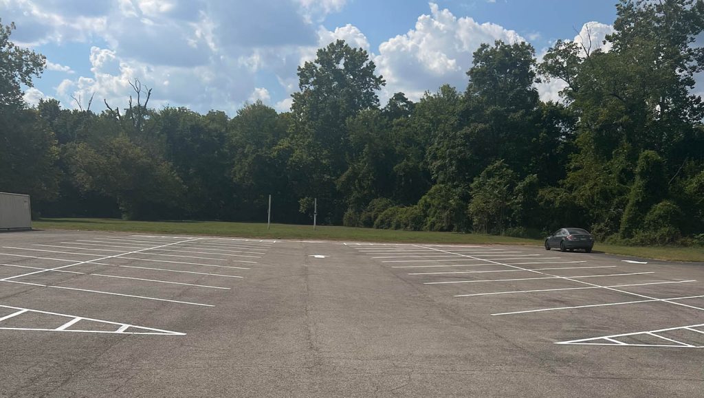 faded parking spot lines for The Greater Faith Church of Deliverance parking lot